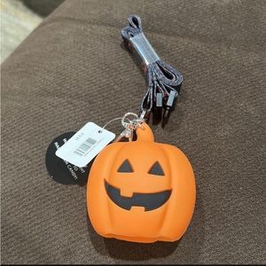 Bath & Body Works lanyard w/ lighted pumpkin small hand sanitizer holder.